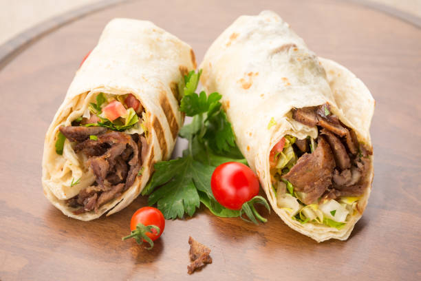 istock Doner kebab on wooden background 647476812