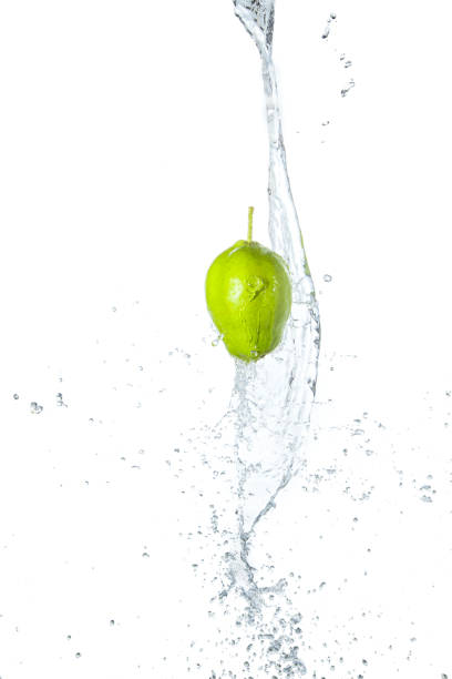 istock Green apple under water with a trail of transparent bubbles. 647478048