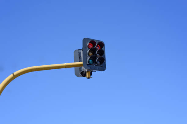 istock Red traffic lights in the blue sky background 647490214