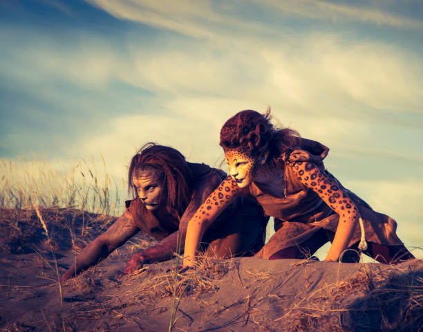 istock Anthropomorphic Lion and Cheetah Actors In The Desert 647494128