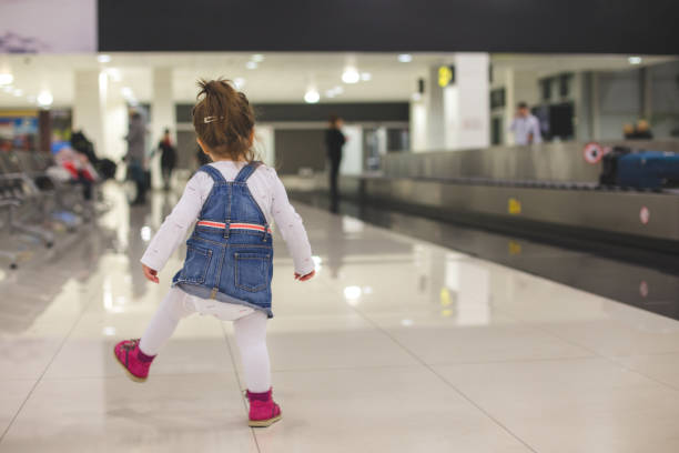 istock Playful toddler at arrival area at airport 647494432