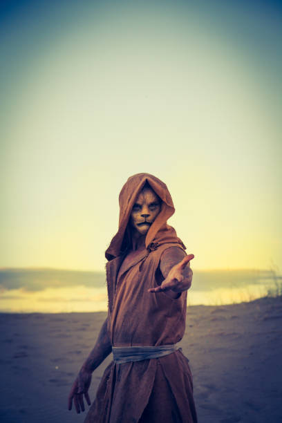 istock Actor Wearing Lion Makeup Posing The Desert 647494496
