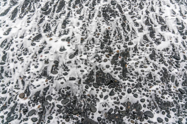 Horizontal shot of Icelandic and volcanic landscape, water and stones