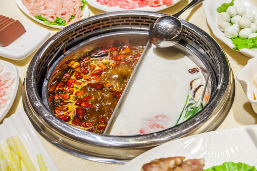 Double flavor Chinese hot pot on the table