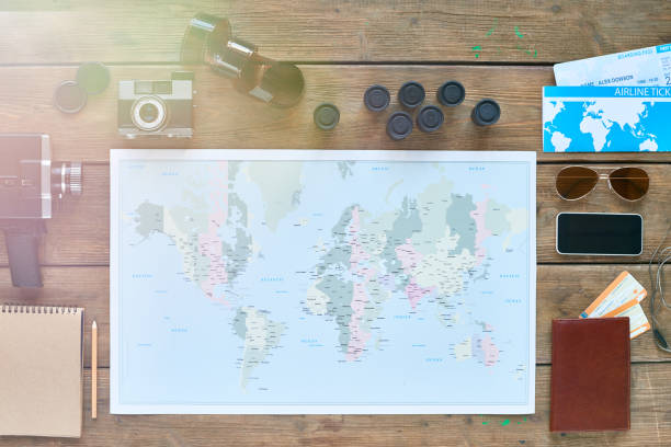 istock Desk with travelers things 647523546