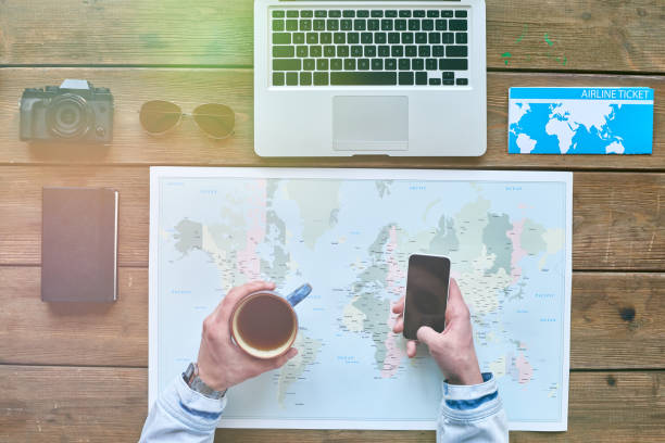 istock Tourist with phone and mug 647523608