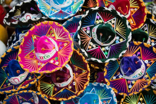 Photo of Colorful Mexican sombrero hats at an outdoor market