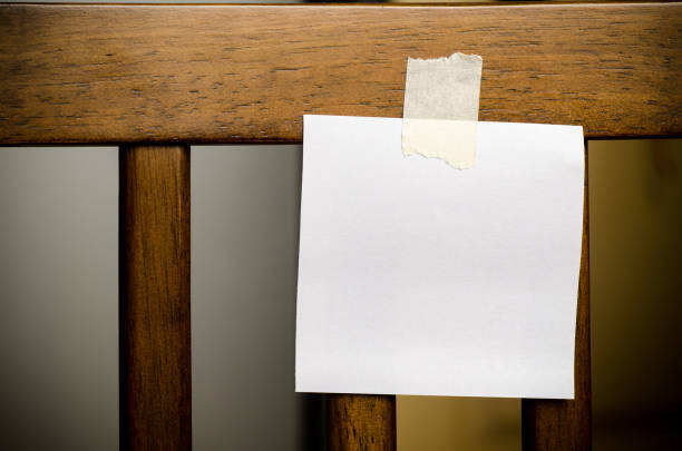 istock Blank paper card stick on chair 647534958