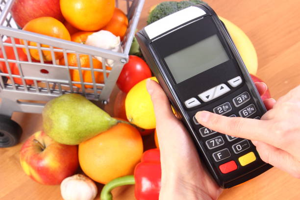istock Using payment terminal, fruits and vegetables, cashless paying for shopping 647535036