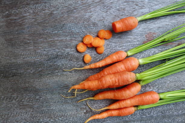 group of fresh carrot on wooden table. stock photo
