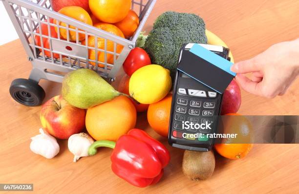 Payment Terminal With Contactless Credit Card And Fruits And Vegetables Stock Photo - Download Image Now