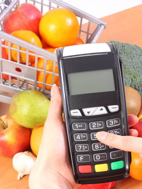 istock Using payment terminal, fruits and vegetables, cashless paying for shopping 647545632
