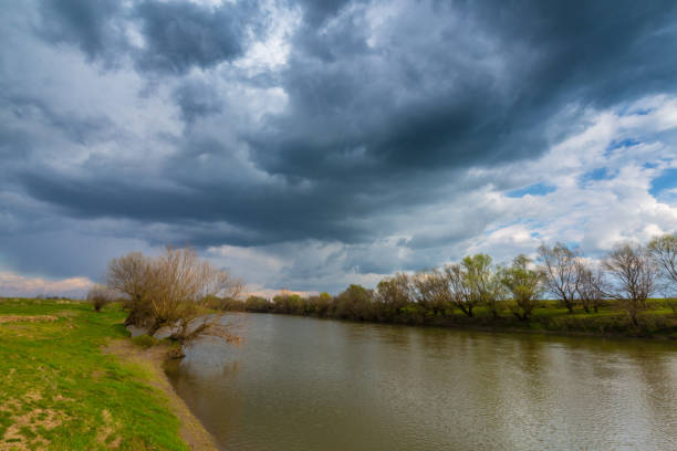 istock Scenery of wild river with sunset cloudy sky reflection 647545706
