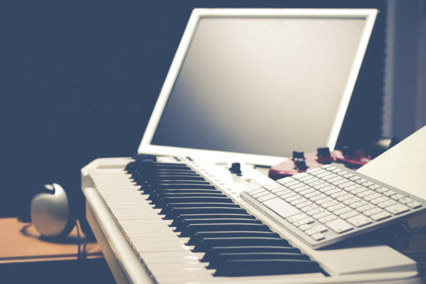 istock music computer concept, piano & computer in sound studio for music production 647548568