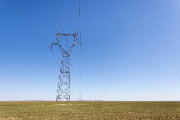 istock electricity transmission pylon in prairie 647548596