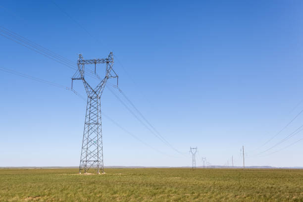 istock electricity transmission pylon in prairie 647548618