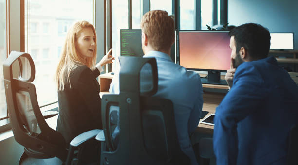 istock Group of IT experts in their office. 647552584