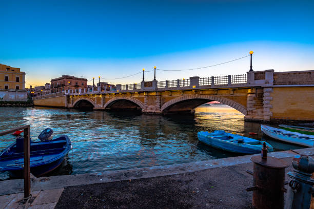 Stone Bridge Stone Bridge wide angle view, Taranto, Italy, Apulia taranto stock pictures, royalty-free photos & images