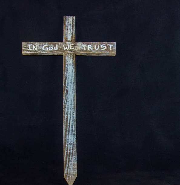 istock Wooden Cross Against Black Background 647556710
