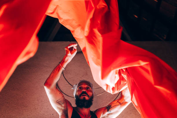 Brazilian artist with red cloth.