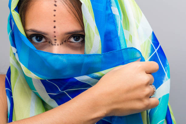Mystic woman with colored veil.