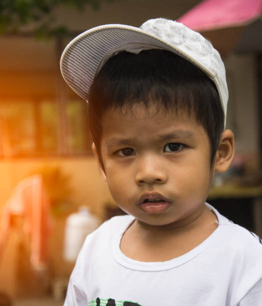 istock serious Asian boy,Thai, acting face in grave time 647563270