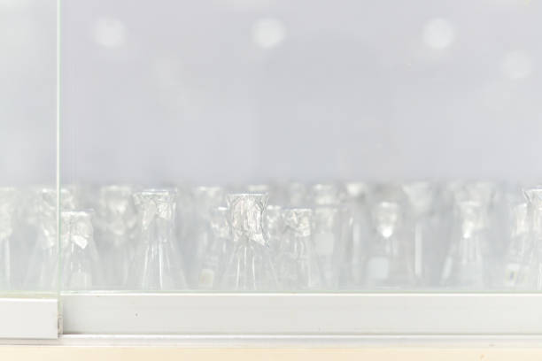 istock blurred flask glass tube laboratory equiment in white. 647566594