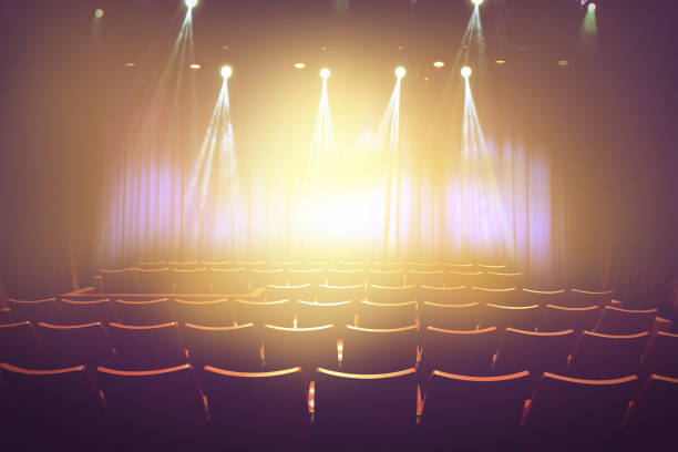 istock vintage theater with lighting spot on stage before showtime. 647567246