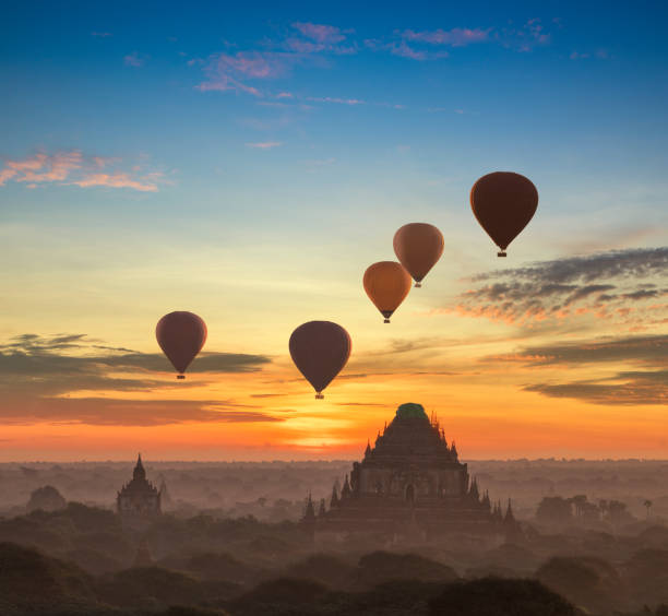 istock Hot air balloon over plain of Bagan in misty morning 647567328