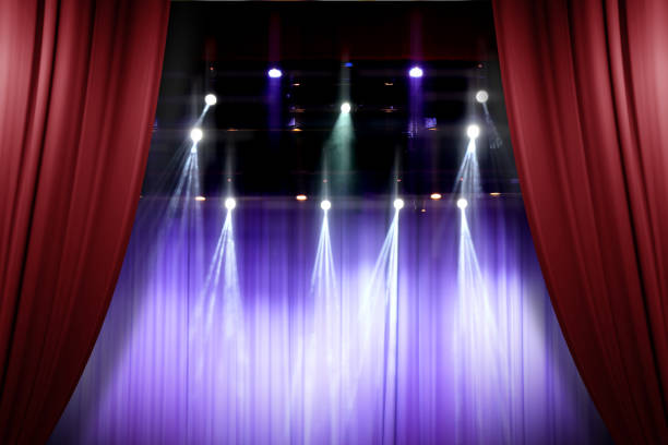 istock theater stage red curtains opening for a live performance background 647567774