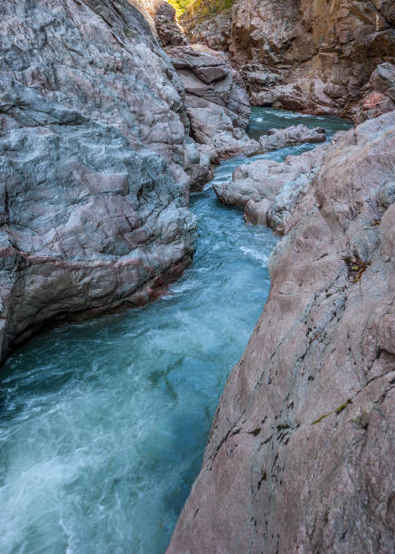 Russia, the Republic of Adygea. White Mountain River in the rocky gorge. Granite Canyon.