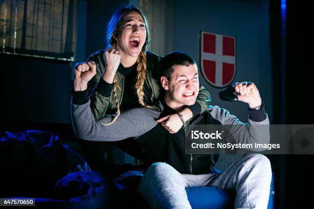 Happy Couple Playing Video Games And Having Fun Together Stock Photo - Download Image Now
