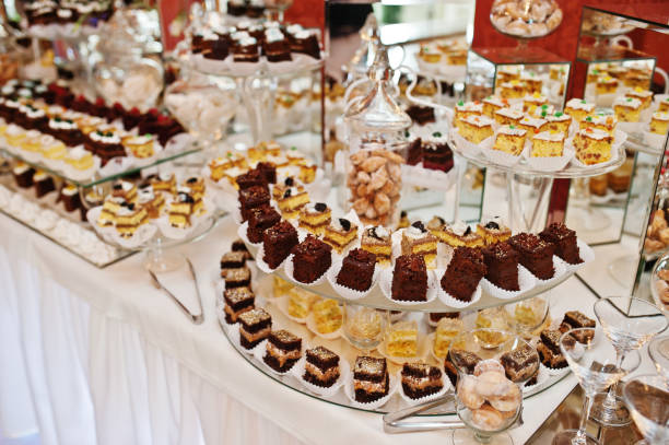 istock Different types of cakes and baking at wedding reception table. 647573910