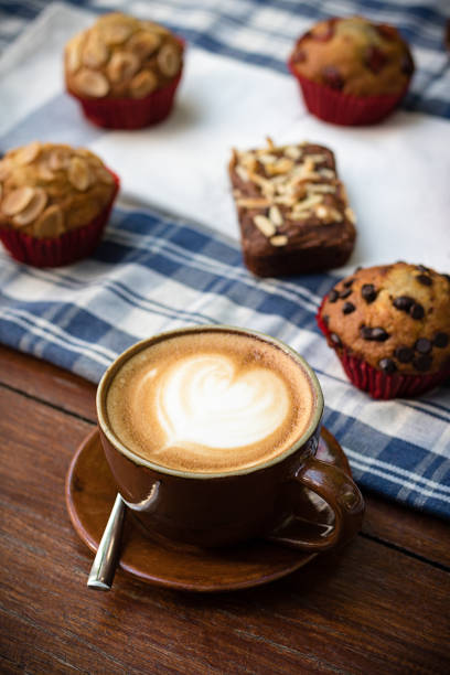 istock White cup of coffee on vintage wood. 647581568