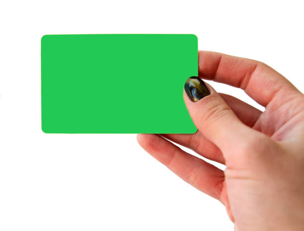 istock Woman's hand holding blue blank plastic credit card, isolated 647583640