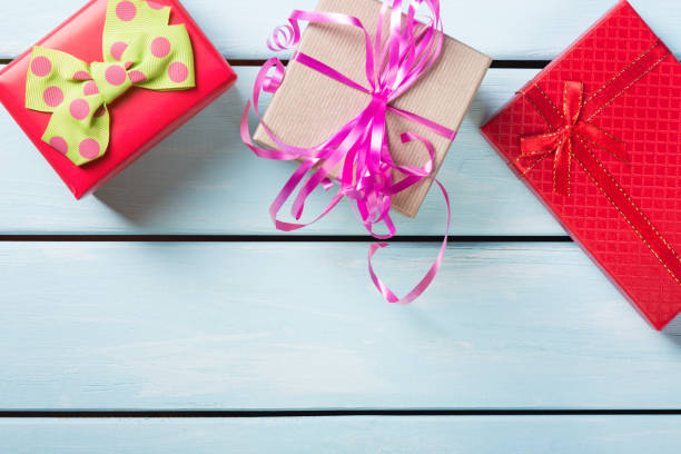 istock Colorful gift boxes on nice blue wooden background 647584988