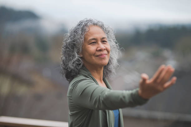 istock Hawaiian woman doing yoga pose outside 647596792