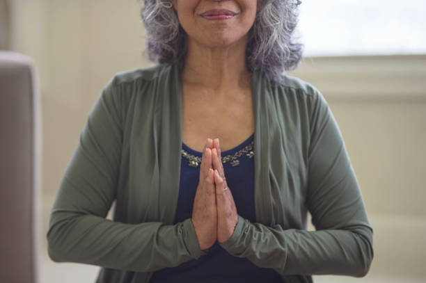 istock Hawaiian woman doing yoga pose inside in morning. 647596800