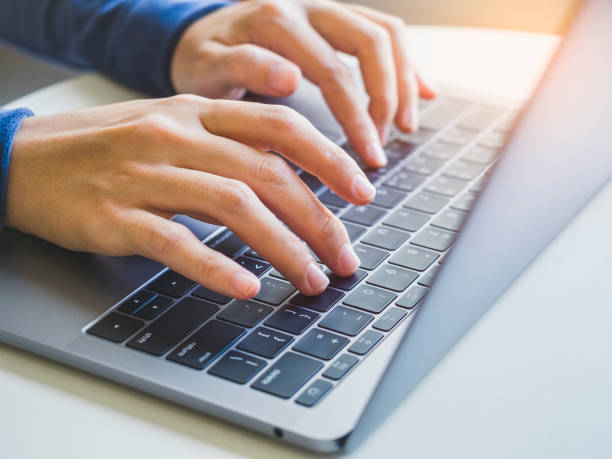 istock Woman hand typing on Laptop Keyboard 647600076