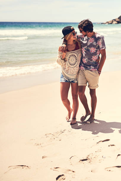 istock Enjoying a romantic walk on the beach 647600108
