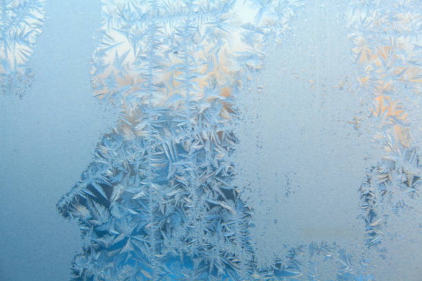 istock beautiful winter texture patterns of frost on window 647603912