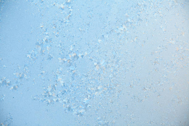 istock beautiful winter texture patterns of frost on window 647604026