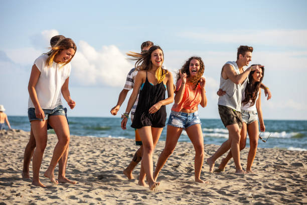 istock Friends enjoying and having fun a beach holiday 647607442