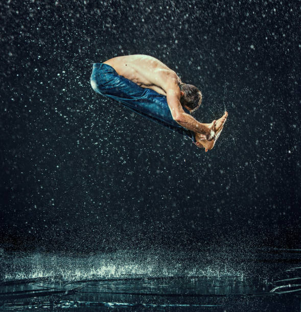 istock The male break dancer in water 647607880