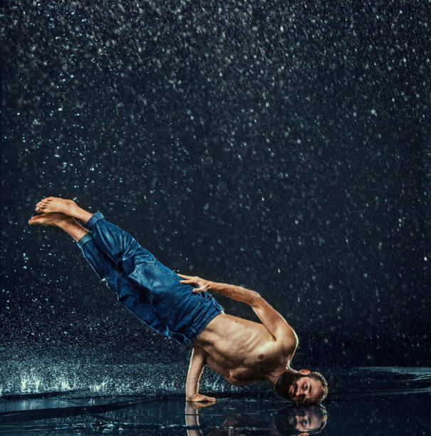 istock The male break dancer in water 647611066
