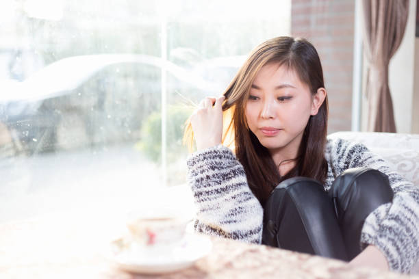 istock young pretty woman sits in cafe 647611218
