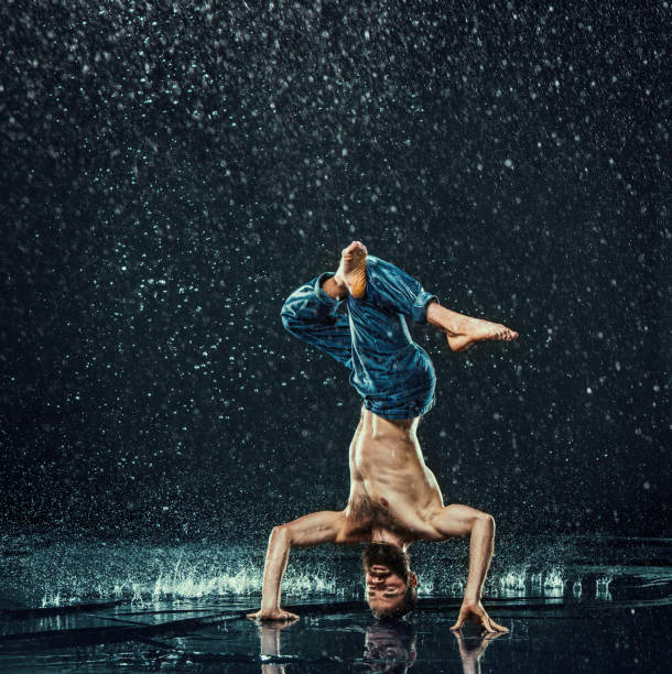 istock The male break dancer in water 647611226
