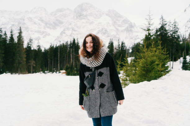 istock Woman walking in the forest in Tatry mountains 647618436