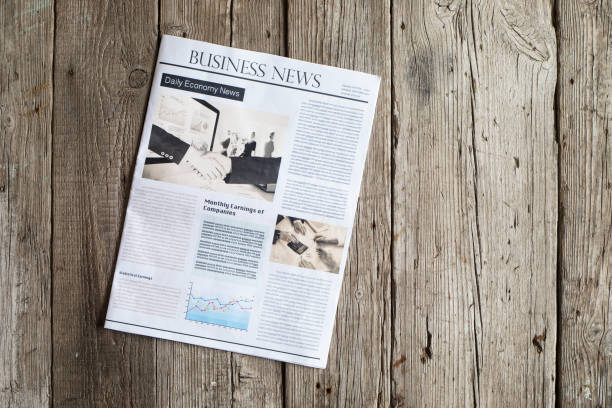 istock Newspaper on wooden table 647619158