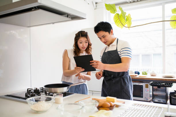 istock Young couple cooking together 647623302